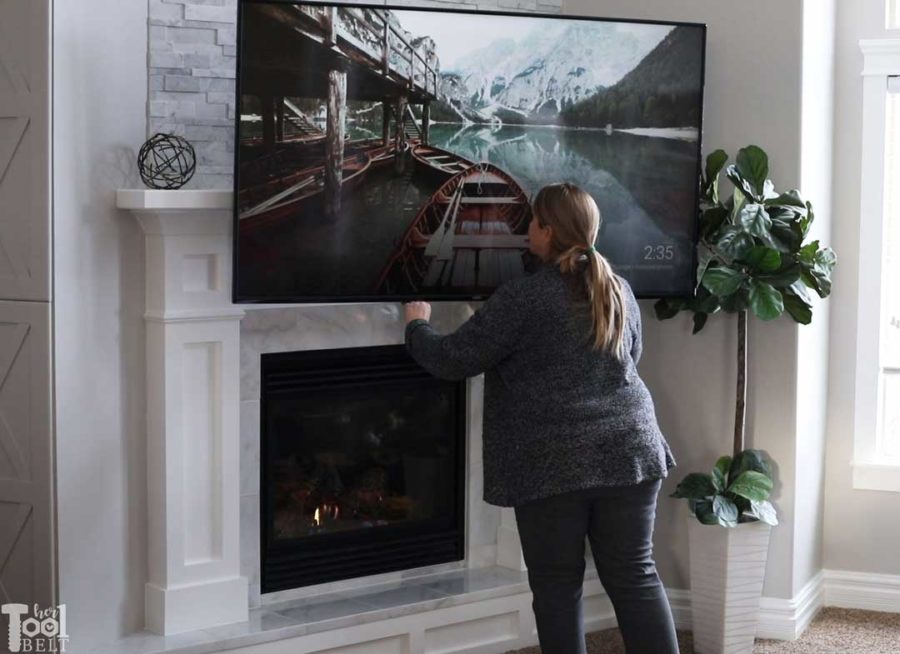 Updating an old builder grade fireplace, into a Modern Farmhouse Mantel. Drop down TV mount for above the fireplace TV's.